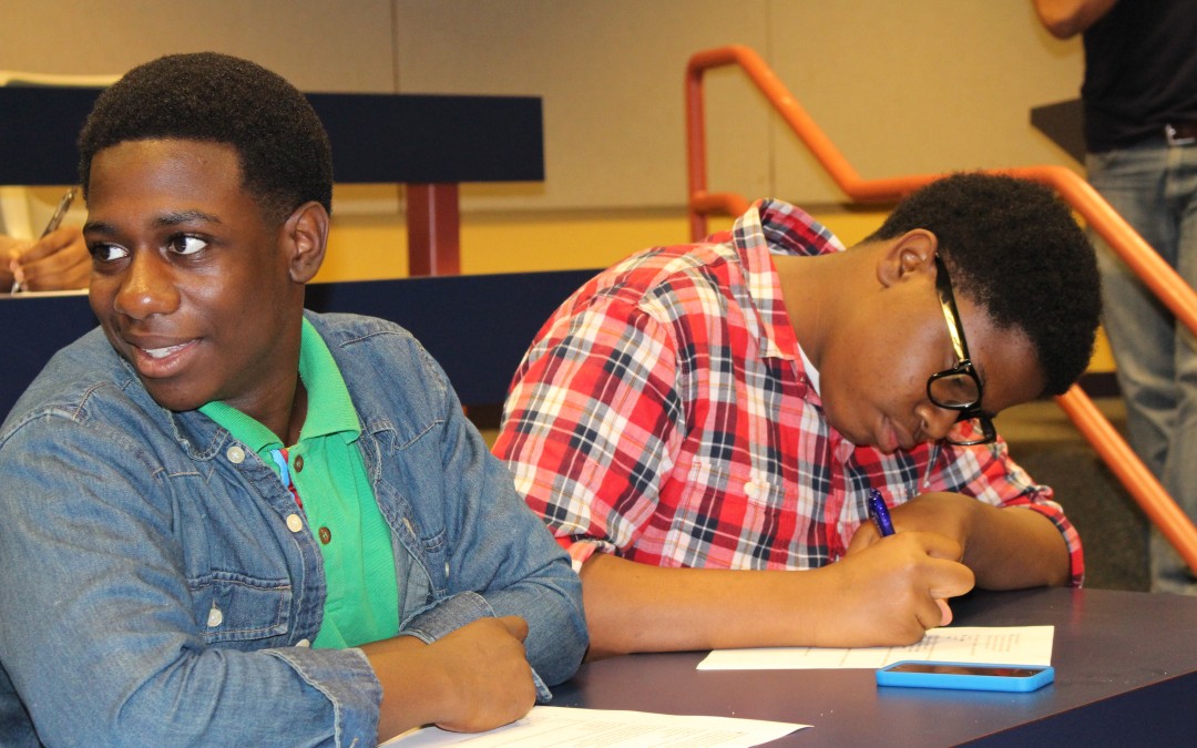 Two students from the Fifth Ward Enrichment Program working on homework