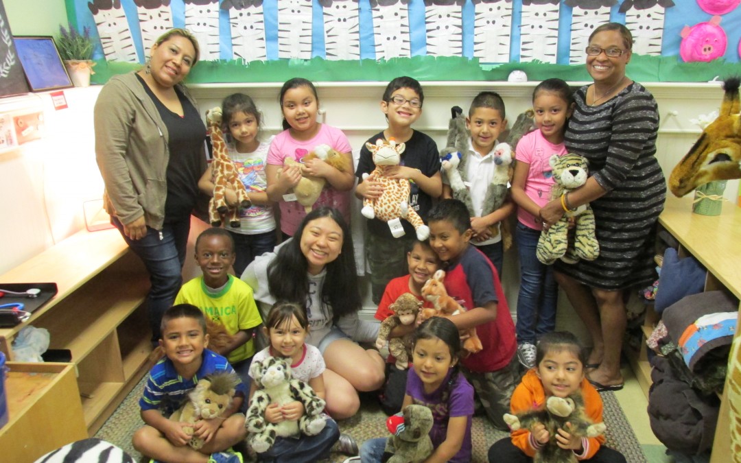 Vickie is surrounded by her students and fellow teachers at her internship at Small Steps Nurturing Center